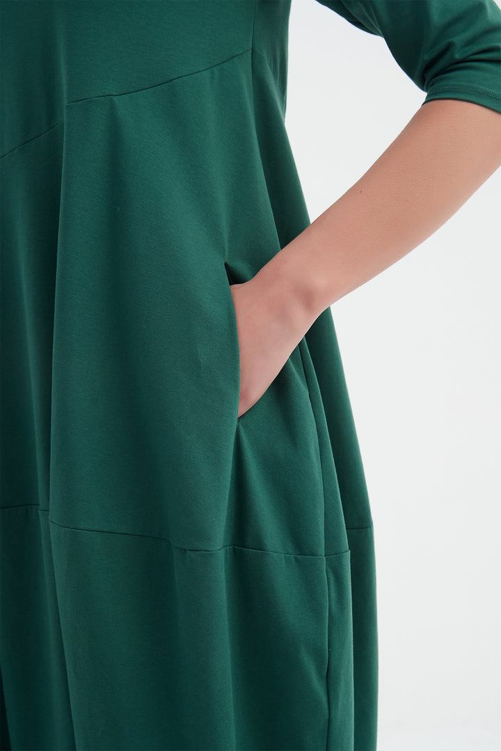 Green dress with a plain background
