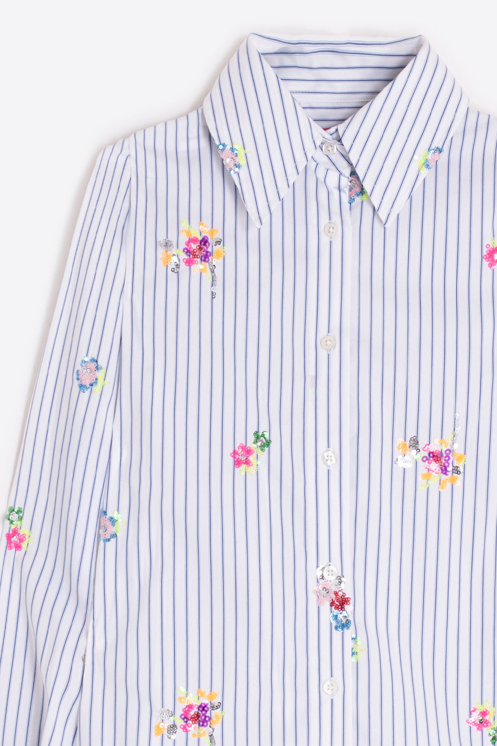 Striped shirt with floral patterns on a white background